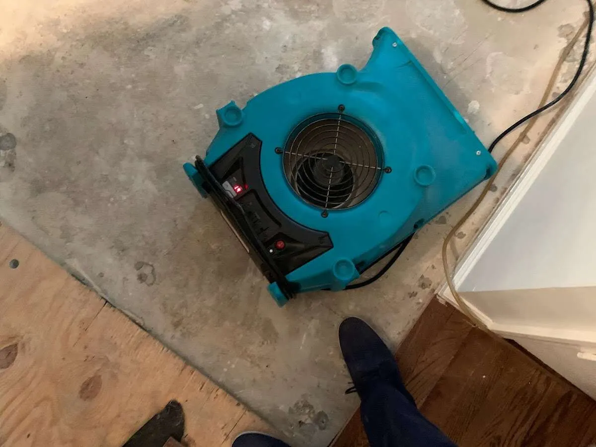 Air mover drying subfloor during Commercial Water Damage Restoration in Lucas Valley-Marinwood